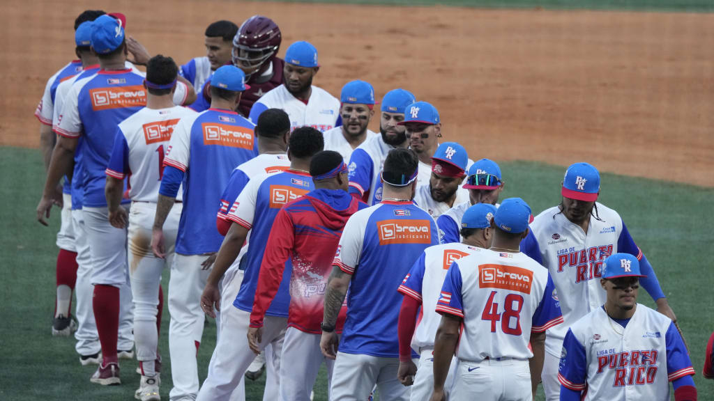 Puerto Rico's players celebrate after defeating Curaçao on Monday. (Fernando Llano/AP)