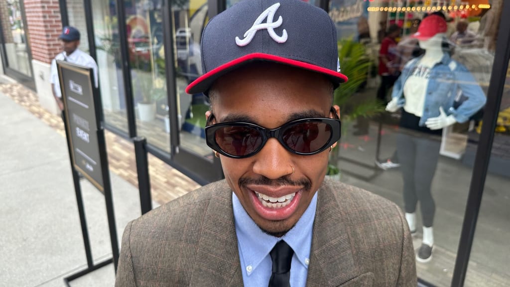 Imani Carrier models a New Era Braves cap.