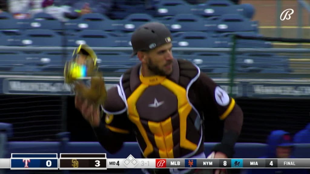 San Diego Padres catcher Austin Nola adjusts his helmet as he