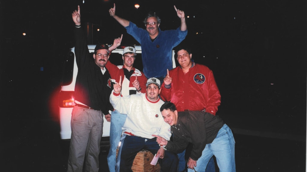 Galiette (left) celebrates the Louisville Redbirds winning the championship in 1995.