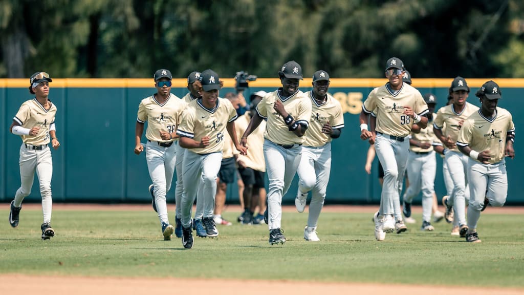 Players work out during the Hank Aaron Invitational on the fields at Jackie Robinson Training Complex on Wednesday in Vero Beach, Fla.