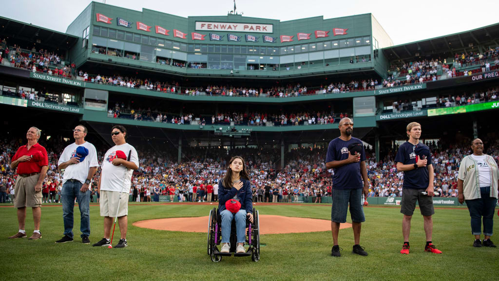 Fans participating in Disability Pride Night line up on the Fenway Park turf pregame on July 26. (Red Sox)