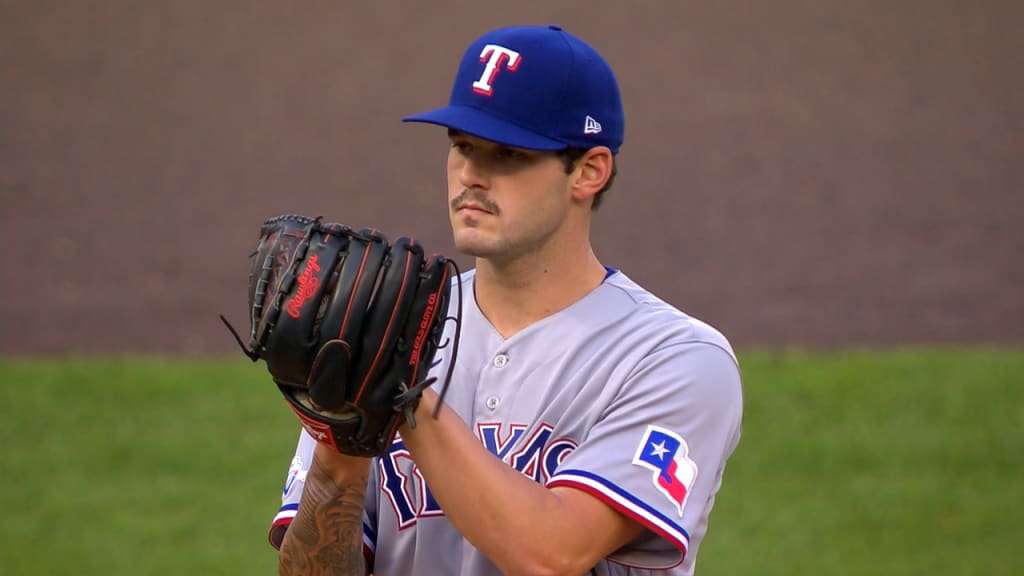 Adolis Garcia of the Texas Rangers fields a ball during the first