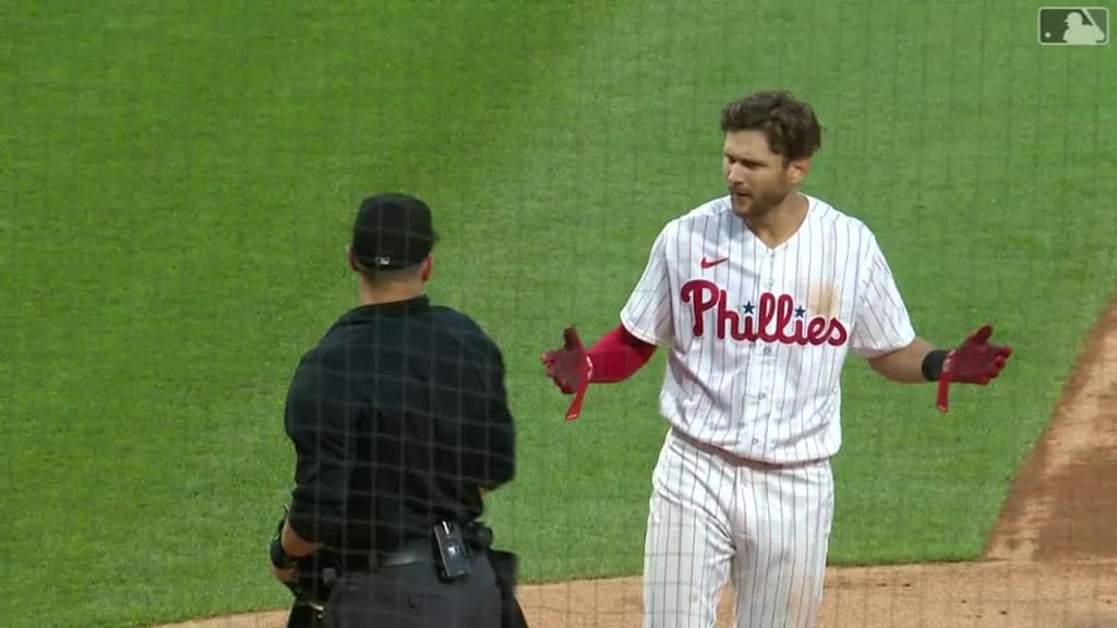 Philadelphia Phillies' Trea Turner slides back to first base on a