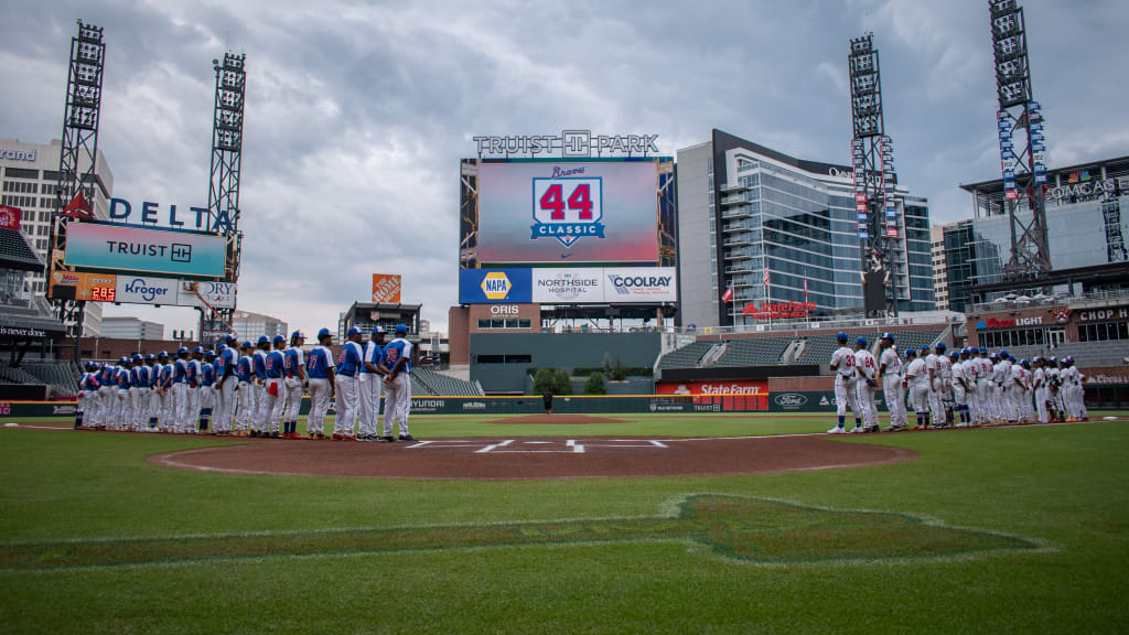 High school players line up along the baselines at Truist Park in Atlanta