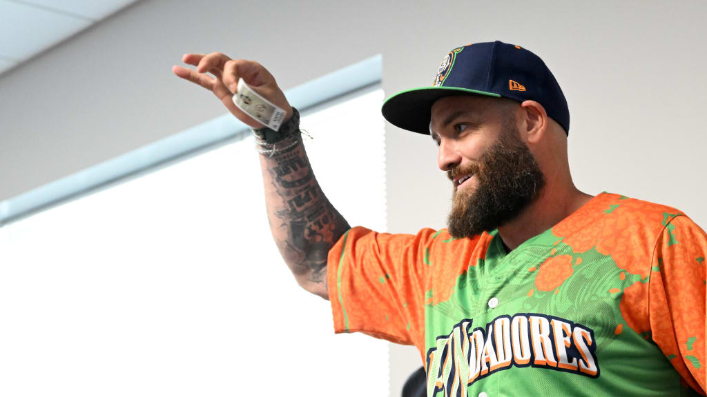 Jonny Gomes holding up one of his selections.