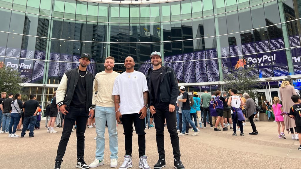 Alex Claudio, Owen Miller, Freddy Peralta and Garrett Mitchell pose before the Bucks-Suns game in Phoenix