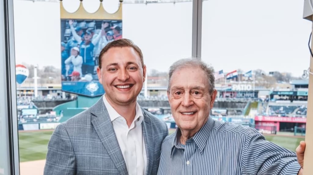 Royals announcers Jake Eisenberg and Denny Matthews pose for a photo
