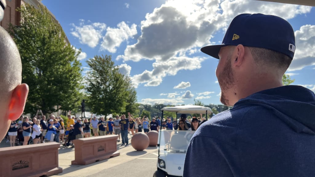 Brewers ride around golf carts, greeting fans in the parking lot before their game on Aug. 23. (Adam McCalvy)