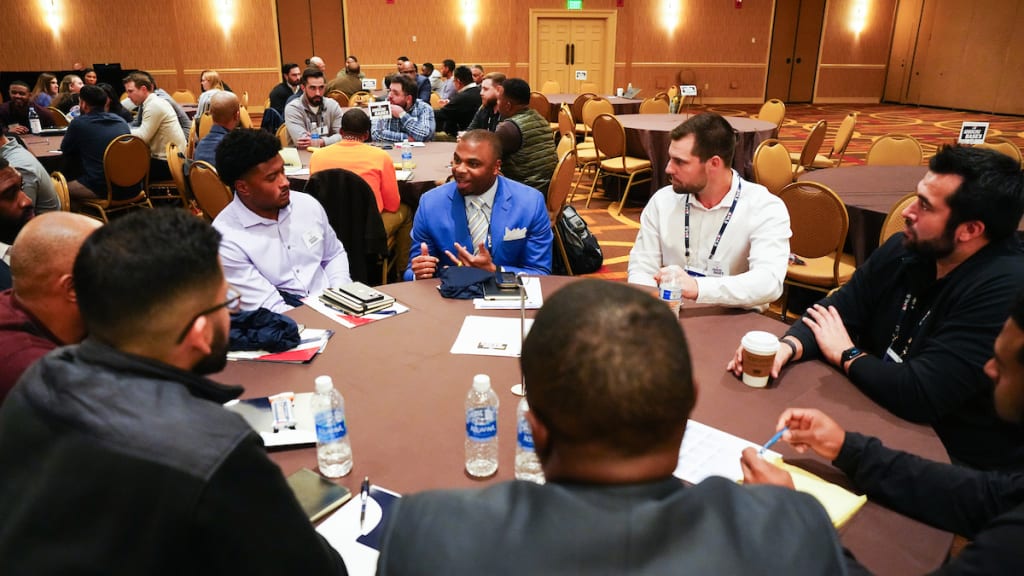 Participants talk during the Advancing Bases event at the 2023 MLB Winter Meetings. (Photo by Mary DeCicco/MLB Photos via Getty Images)