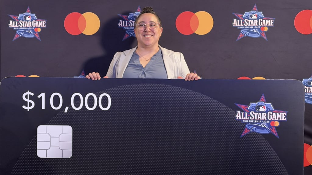 Shana Pistilli, posing with her winnings from the 2026 MLB & Mastercard Small Business Contest.