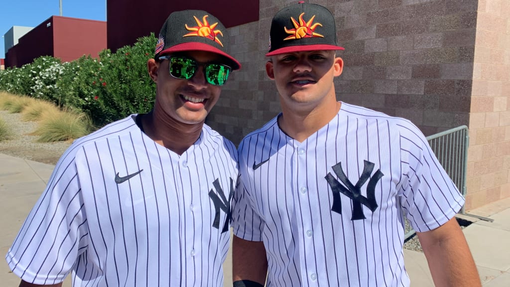 Jasson Domínguez (right) is developing his base-stealing skills with Yankees coach Jose Javier.