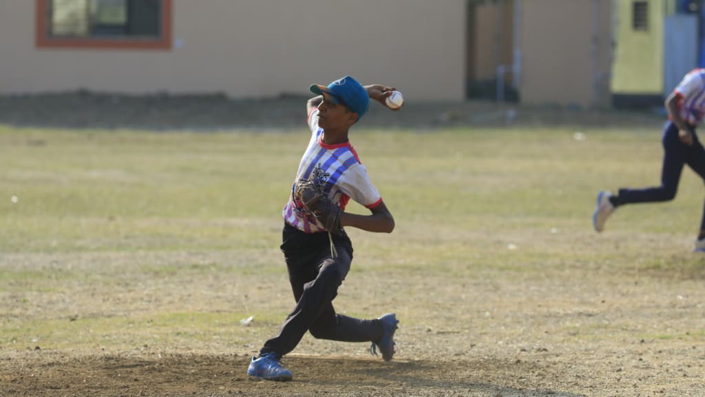 A young player throws a pitch in India. Photo courtesy MLB India.
