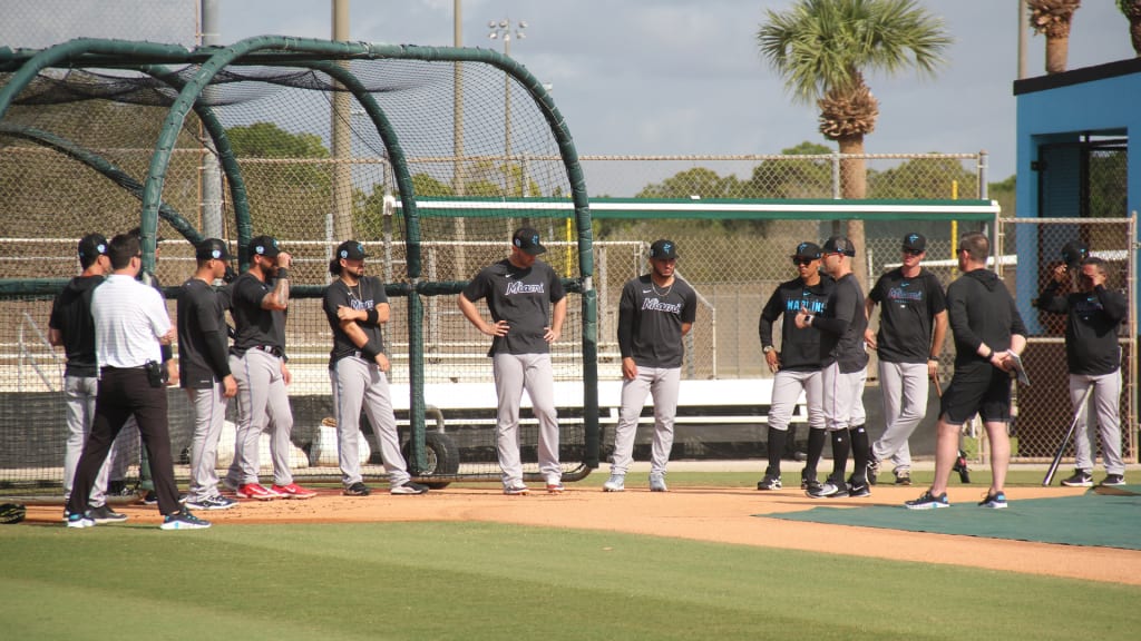 Marlins manager Skip Schumaker talks with the organization's catchers at Spring Training.