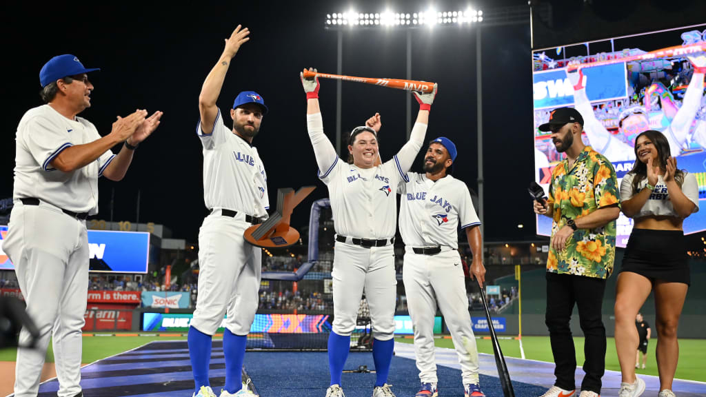 Rachel Garcia lifts the HRDX MVP Award -- a special orange bat -- after helping lead her Blue Jays teammates to the HRDX victory in Kansas City.