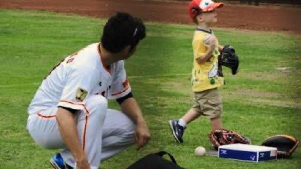 Tomoyuki Sugano and Scott Mathieson's son, Lane, photo courtesy of Scott Mathieson