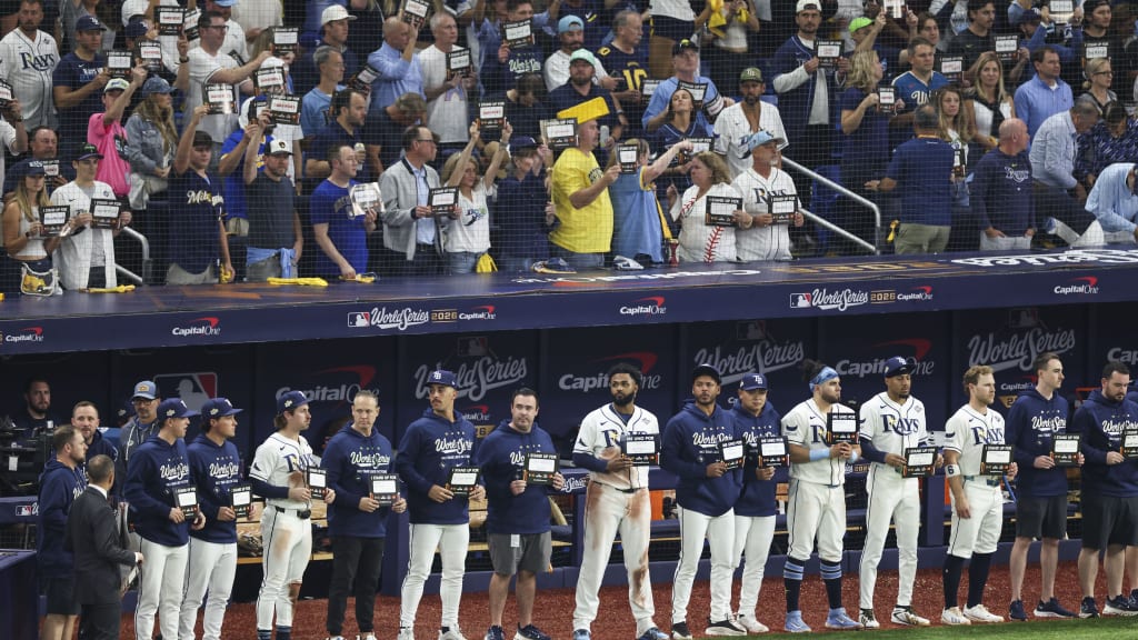 The Rays stood by the dugout holding up their Stand Up To Cancer cards during Game 4 of the World Series.