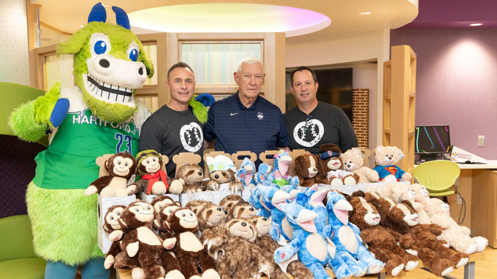 Veteran umpire Dan Iassogna, former University of Connecticut college baseball coach Andy Baylock and former umpire Jim Reynolds visit Connecticut Children's Medical Center.