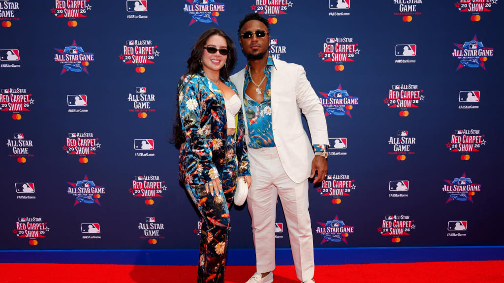Ozzie Albies and his wife in their matching koi-inspired outfits (Getty Images)