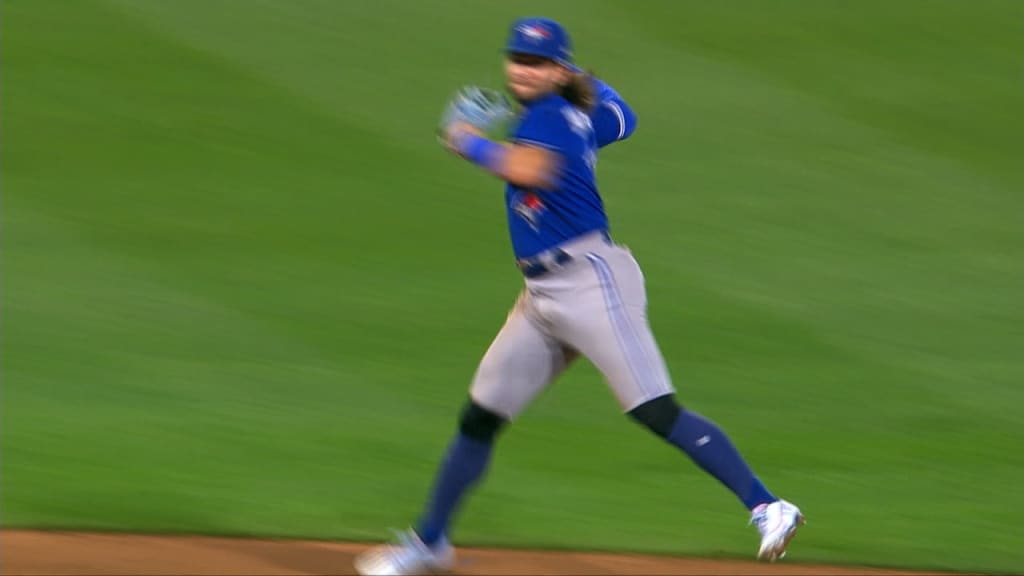 Bo Bichette of the Toronto Blue Jays leaps as he runs into home