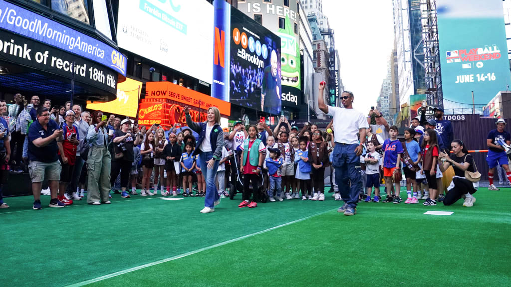 Francisco Lindor and Girl Scouts CEO Bonnie Barczykowski throw a pair of pitches. (Mary DeCicco/Getty)