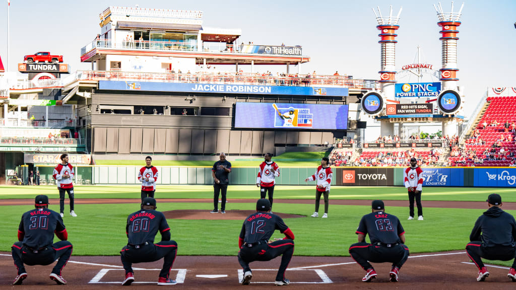 Members of the Cincinnati Cyclones hockey team throw out the ceremonial first pitch at Great American Ball Park.