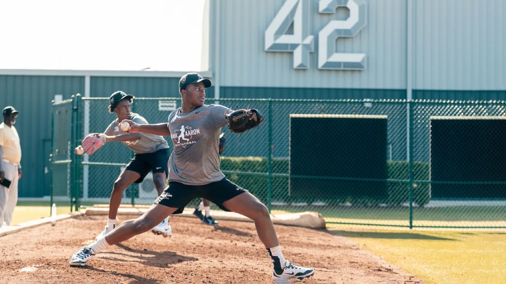 Pitchers work out during the Hank Aaron Invitational in the bullpen at Jackie Robinson Training Complex on Sunday in Vero Beach, Fla.