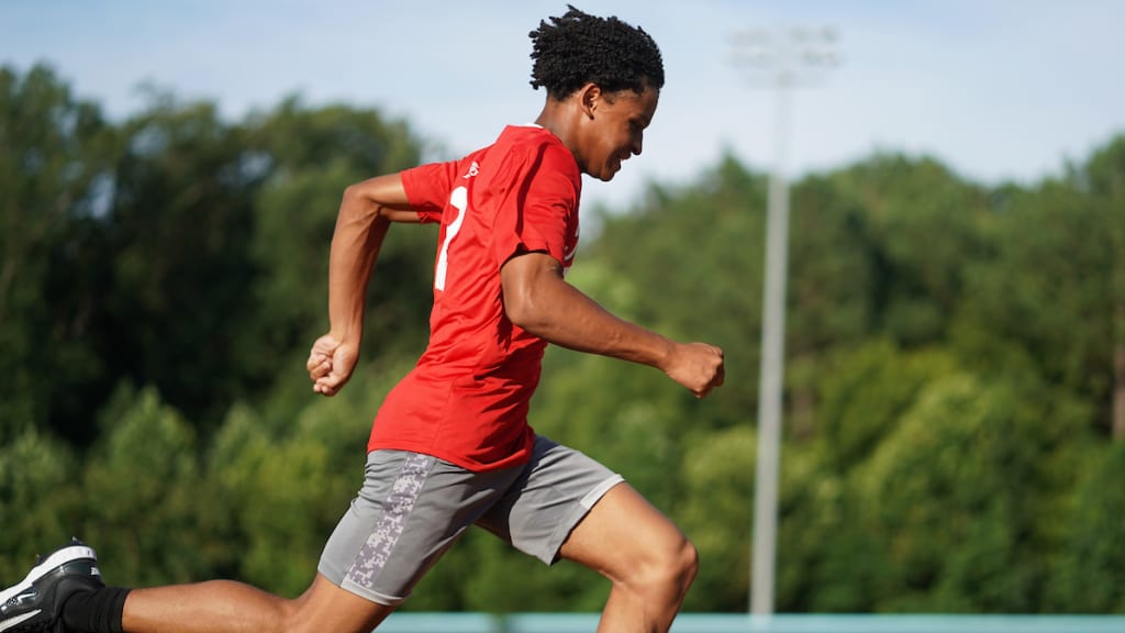 A participant runs the bases during the opening ceremonies for the All-Star Commissioner’s Cup and Jennie Finch Classic in Atlanta. (Lyndon Terrell/MLB Photos)
