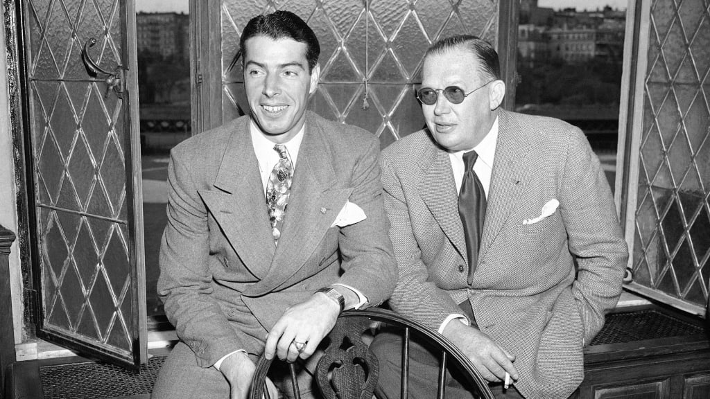 Larry MacPhail (right) with Yankees star Joe DiMaggio in 1947. MacPhail was instrumental in bringing about the first night game in AL/NL history.