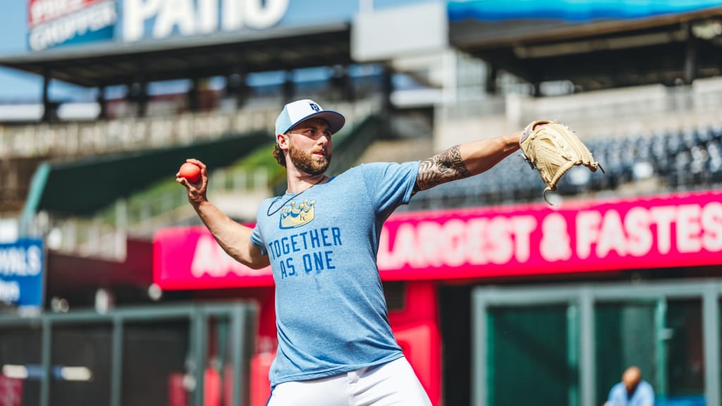 Royals starter Alec Marsh plays catch in the outfield prior to a recent game.