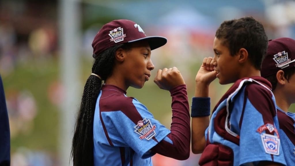 Mo'ne Davis, left, and Scott Bandura compete in the 2014 Little League World Series with their team from Philadelphia.