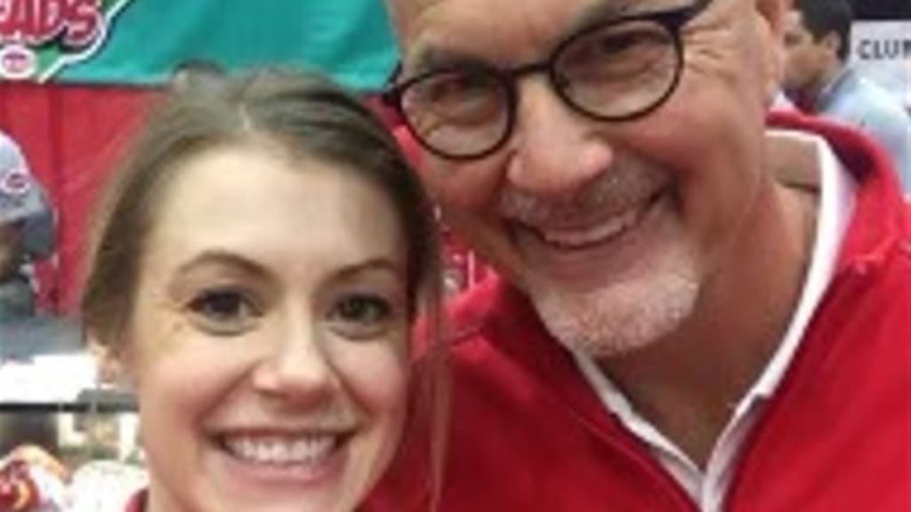 "Reds baseball has been not only part of my professional career, but a part of my whole life and my family’s life too," said Dr. Timothy Kremchek, posing with one of his four daughters.