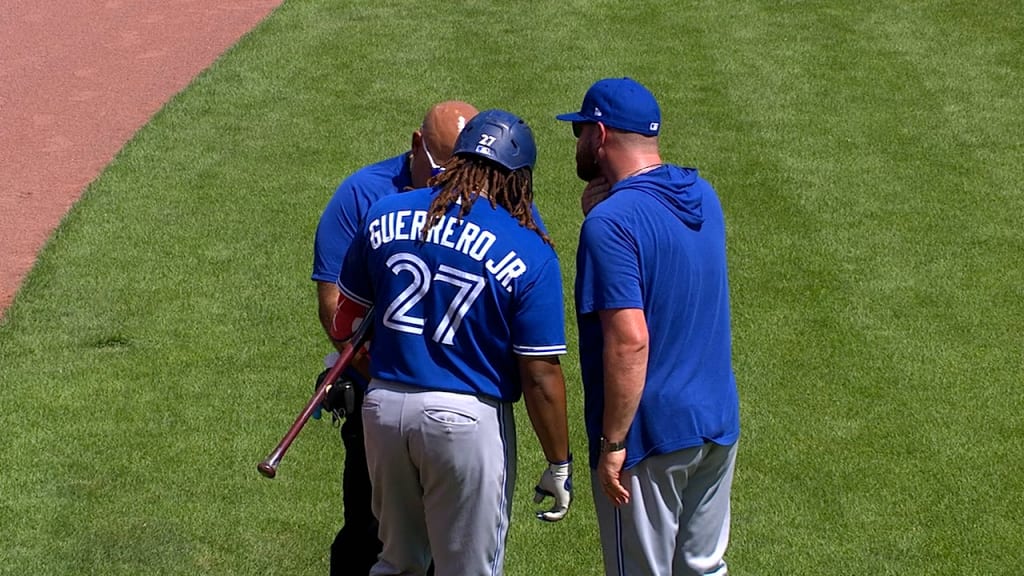 Baseball Hall of Famer Vladimir Guerrero, left, talks with