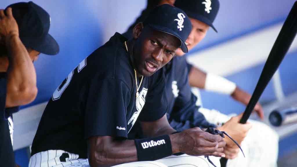 Michael Jordan takes in a Spring Training game from the dugout. (Photo via Getty Images)