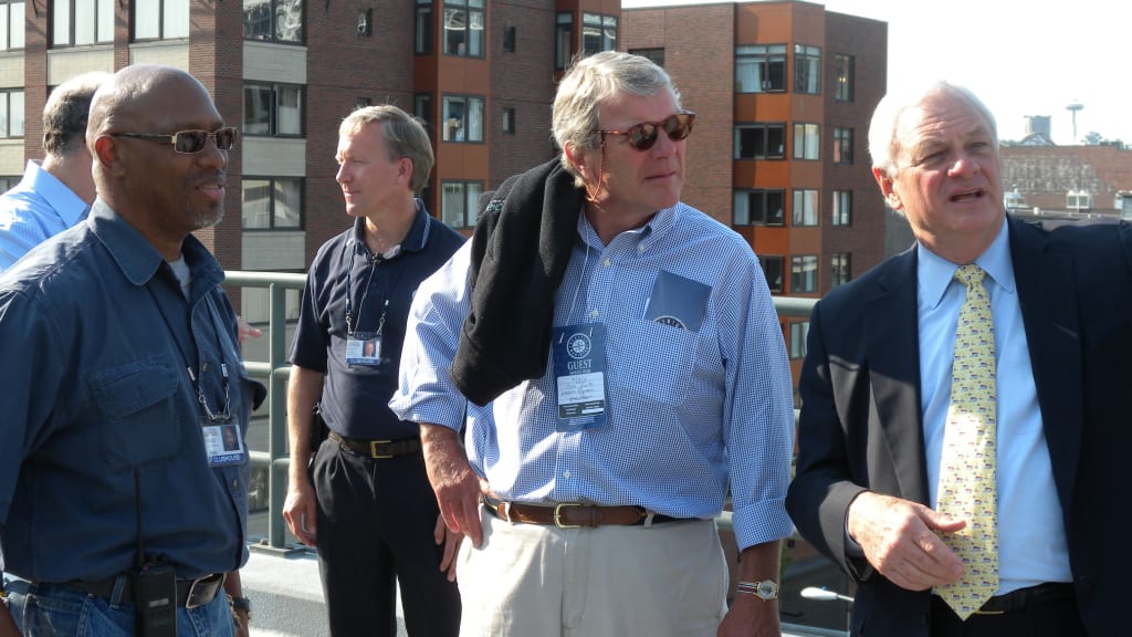 Vance Akres (left), is pictured with former Mariners president Chuck Armstrong (right), on the north track runway in 2010. (Courtesy of Vance Akres)