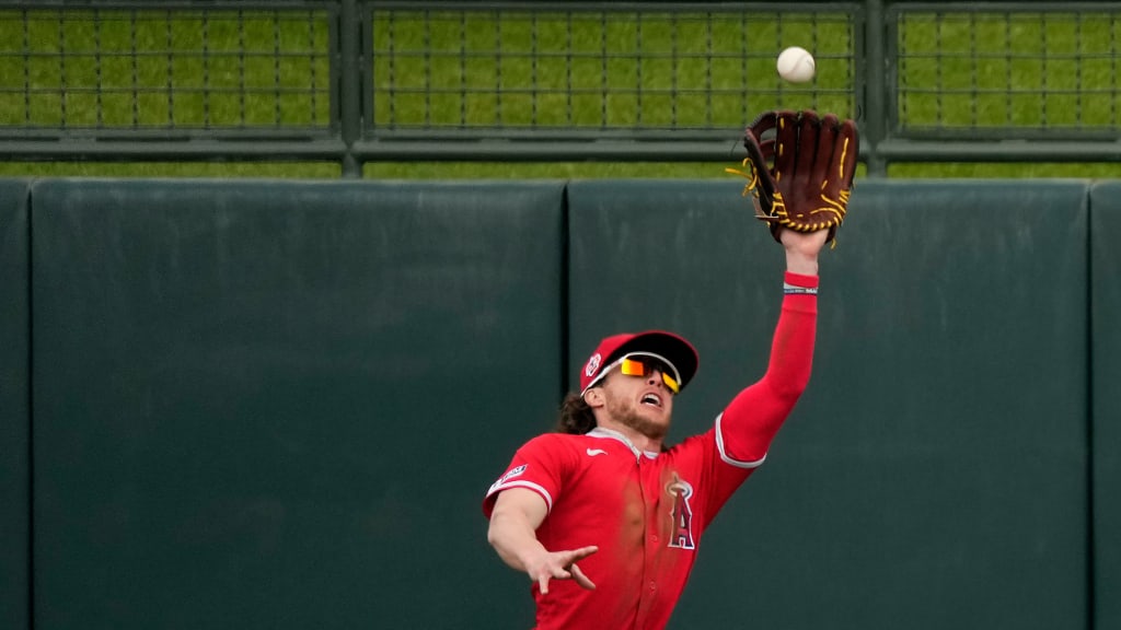 Brett Phillips leaps for a catch against the Royals on March 2, 2023.