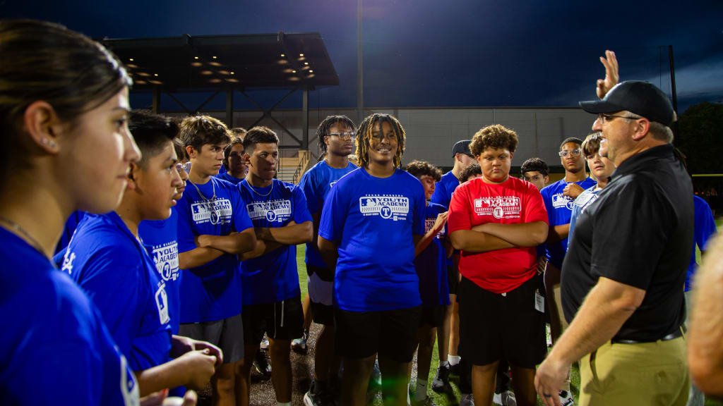 Youth Academy athletes receive umpire training from a member of UMPS CARE Charities.