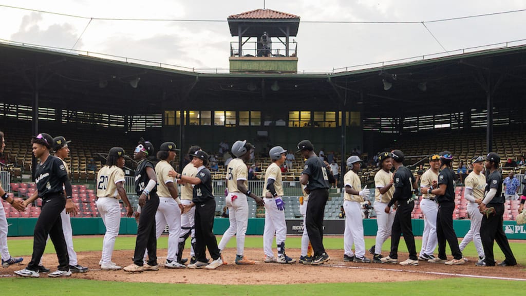 Players from both teams shake hands after the 2025 Hank Aaron Invitational Showcase Game at Rickwood Field on Wednesday.