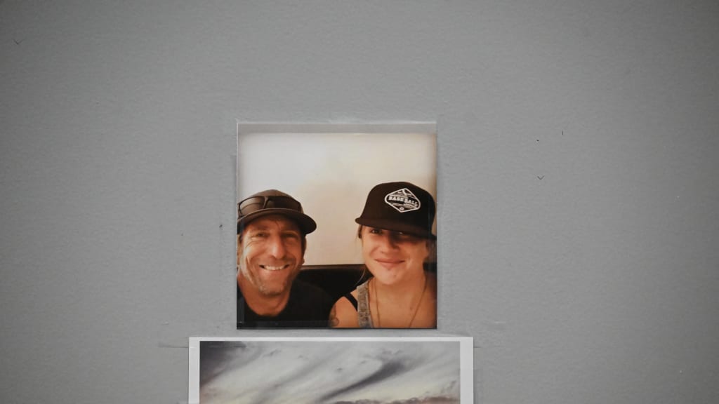A picture of Conklin and his daughter, Jordan, hangs on his office wall, above a photo of his favorite beach in Malibu.