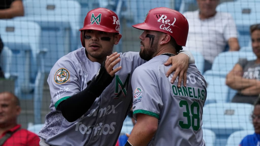 Mexico's Rodolfo Amador (left) and Julian Rafael Ornelas celebrate after scoring two runs against Cuba.