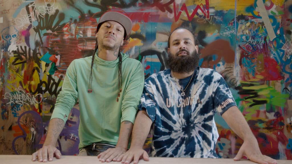 Muralist David “Don Rimx” Sepulveda (left) and mixed media artist Carlitos Skills.