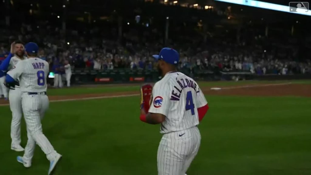 CHICAGO, IL - AUGUST 24: Chicago Cubs center fielder Nelson Velazquez (4)  walks off the field at the end of the second inning during a regular season  game between the St. Louis