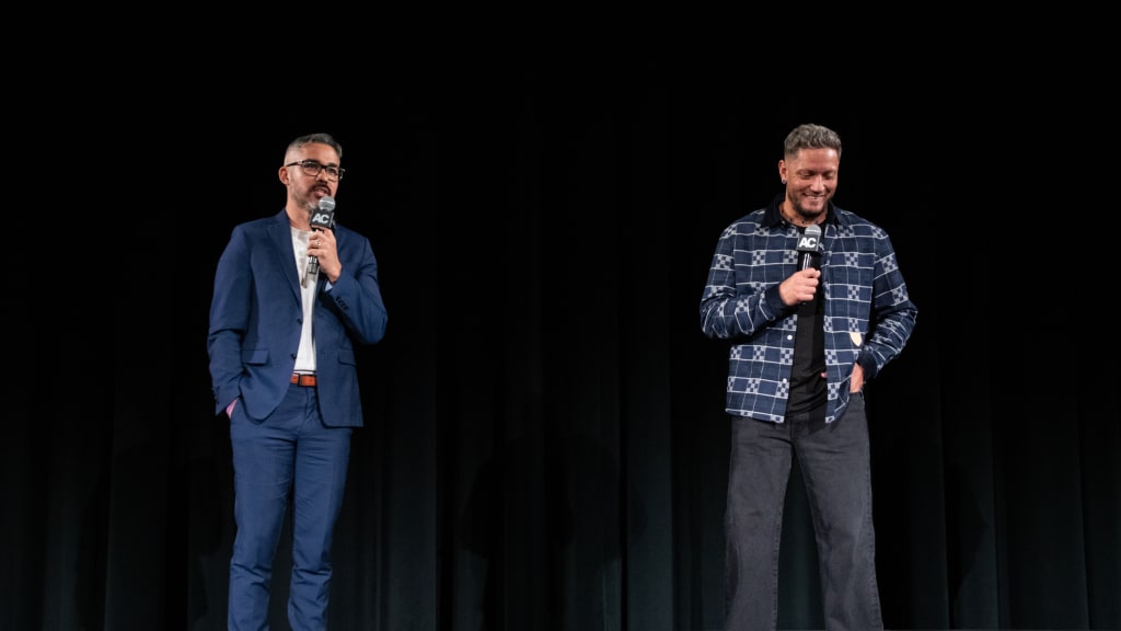 Miguel Rojas speaks at the event alongside Stephen Nelson. (Photo by Jared Cowan)