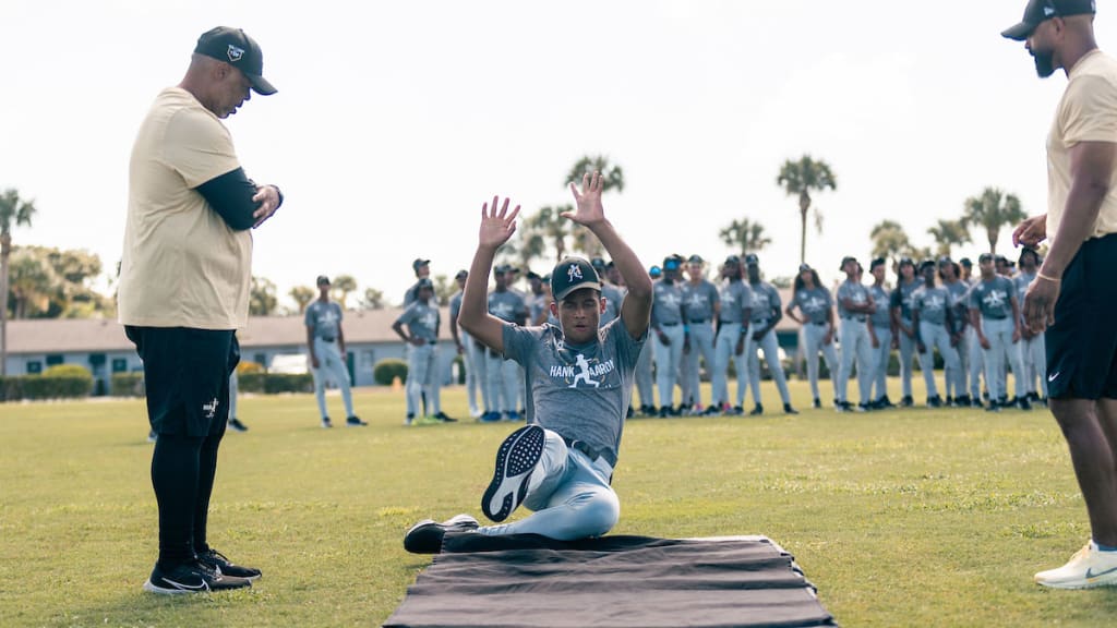 Players work out during the Hank Aaron Invitational on the fields at Jackie Robinson Training Complex on Sunday in Vero Beach, Fla.