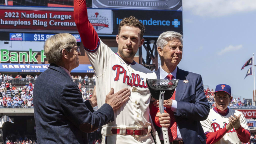 Philadelphia Phillies first baseman Rhys Hoskins (center) tips his hat with Phillies president Dave Dombrowski (right) and CEO John Middleton during the National League ring ceremony