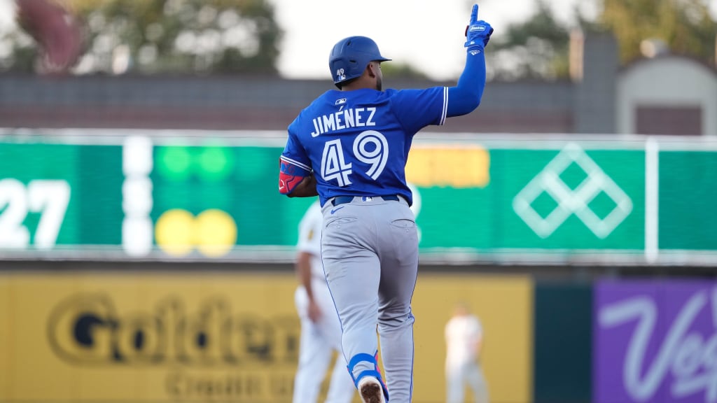 Leo Jiménez holds one finger in the air as he rounds the bases after his first home run of 2025