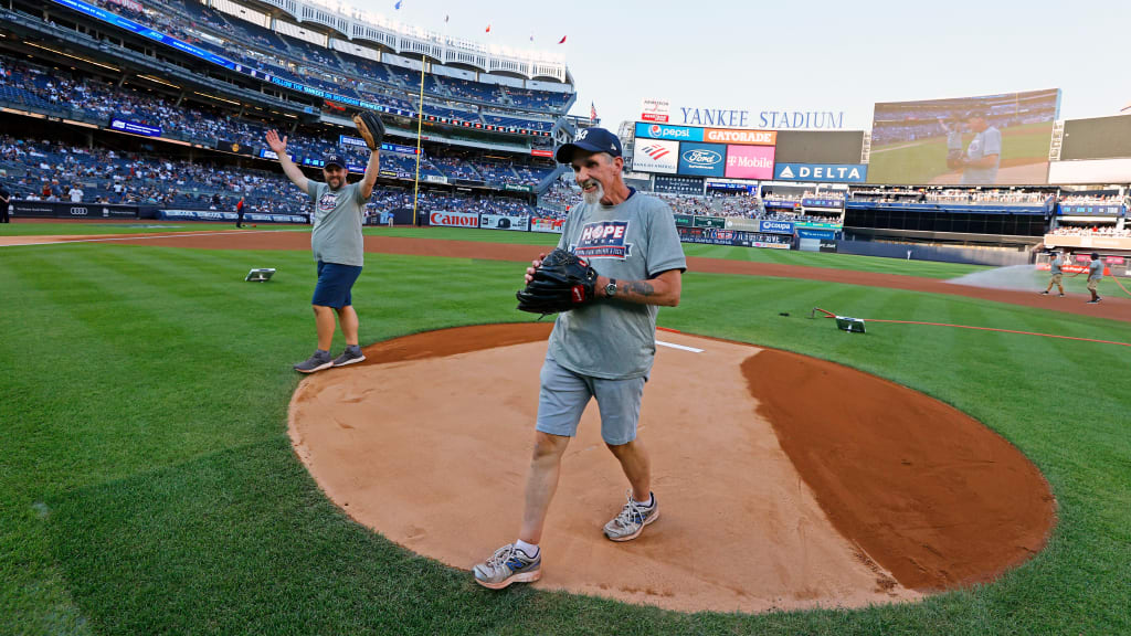 When Dan Reischel (left) set out to have 162 games of catch, he knew that he wanted his father -- a two-time cancer survivor and lifelong Yankees fan -- to play the role of “closer” on the endeavor. Neither could have imagined that their ultimate game of catch would take place on the Yankee Stadium grass. (Photo Credit: New York Yankees)