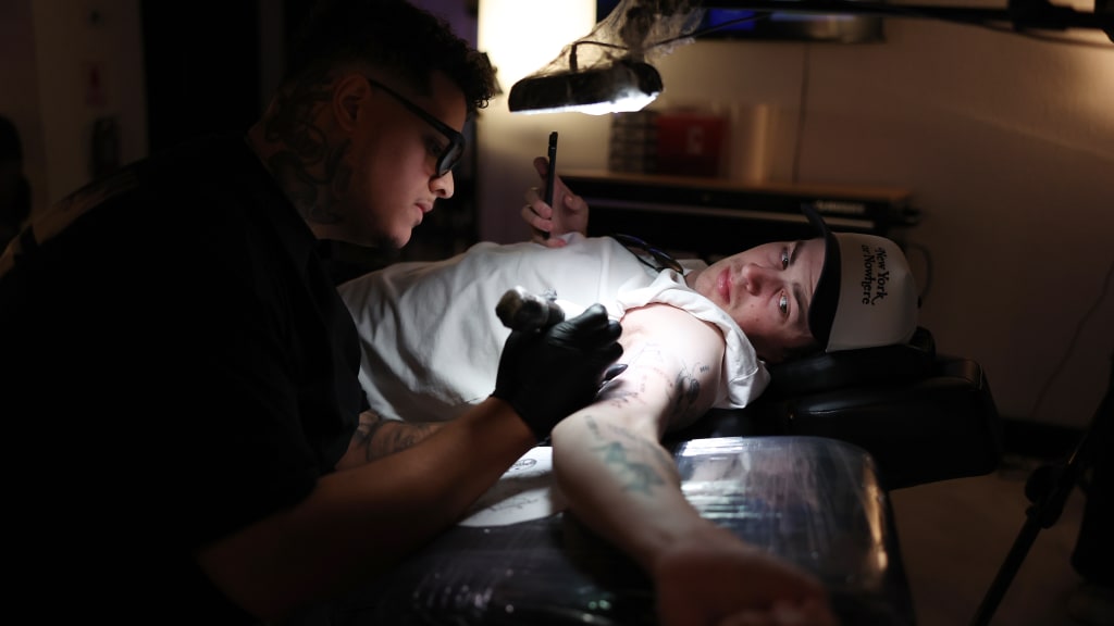 To thrive on a big league stage, Schlittler -- like any pro ballplayer -- spends an inordinate amount of time sculpting his physical shape in the weight room. But that’s not the only time he spends working on his body. The pitcher has tattoos up and down his left arm, including a few that he added over the winter. The ink, deeply personal and intricate, helps paint a picture of Schlittler’s mindset. (Photo Credit: New York Yankees)