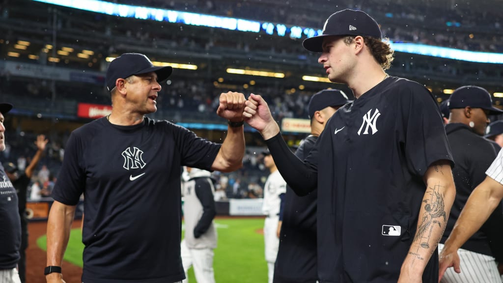 Triple-digit heat has a way of breeding confidence, and Boone [left] is very much aware of how the team benefits from being able to call on a hurler with top-notch stuff. But Schlittler’s ability to light up radar guns is complemented by a looping curveball and a new cutter that has kept hitters on both sides of the plate off balance. “All that stuff really just makes the fastball that much better,” says Rice. (Photo Credit: New York Yankees)