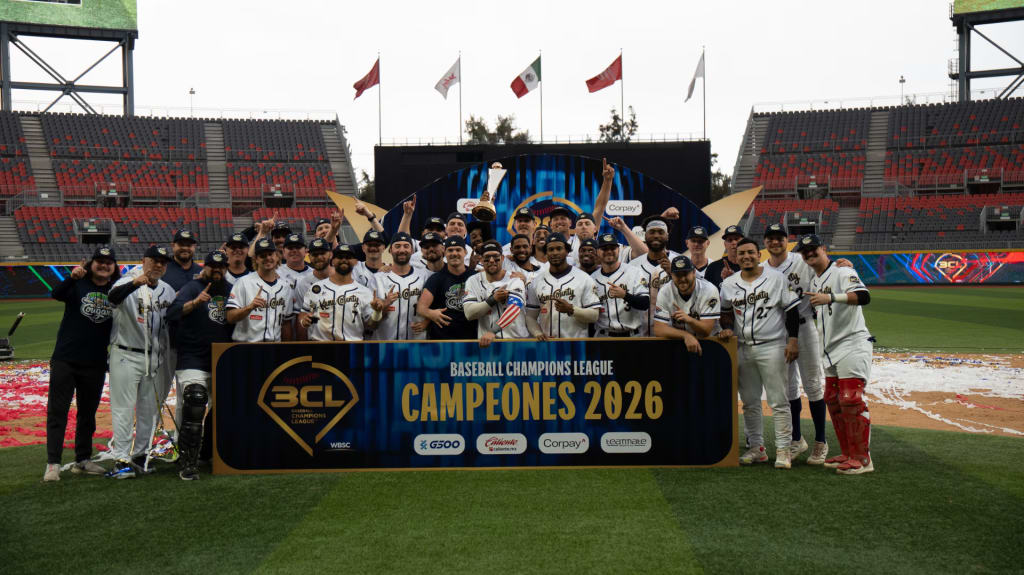 The Kane County Cougars celebrate while Claudio Finol shows off his American flag sleeve. Photo courtesy the American Association.